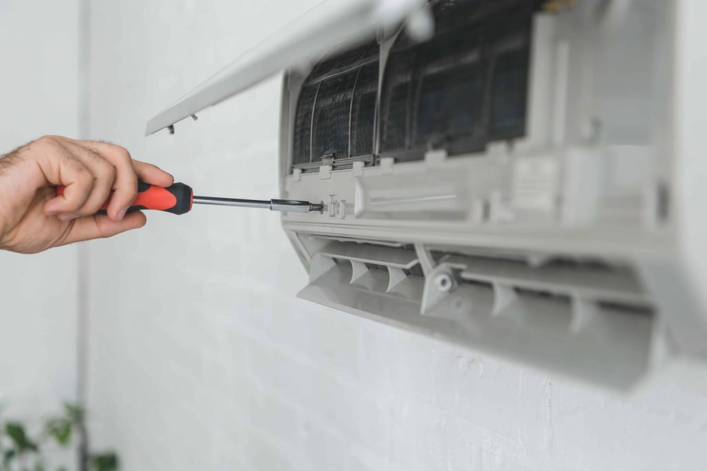 partial view of male worker repairing air conditio 2022 12 16 15 56 05 utc